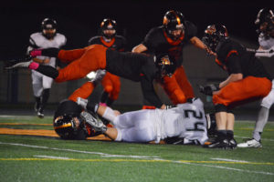 Four Washougal Panthers pursue a Woodland Beaver Friday, at Fishback Stadium. Washougal defeated Woodland 26-8. 