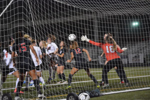 Alyssa Tomasini heads in a corner kick by Perri Belzer for her 19th goal of the season for the Camas girls soccer team Oct. 20, at Doc Harris Stadium. The Papermakers beat Union 3-0. 