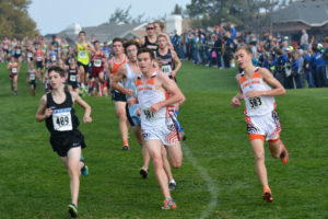 Washougal runners Aiden Pullen and Gabriel Dinnel make the turn at the first mile of the 2A boys state cross country race Saturday, in Pasco. 