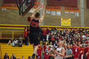 Alex Glikbarg dunks the basketball off of a steal Dec. 2, at Prairie. The Camas High School senior scored 18 points, but the Falcons defeated the Papermakers 60-53.