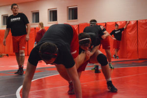 Dylan Ingram and Sam Malychewski push each other on the wrestling mat at Camas High School. The Papermakers hope to contend in league matches, defend their district title and send a strong squad to state at the Tacoma Dome. 