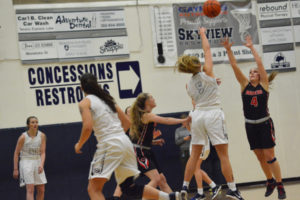 Camas guards Meghan Finley (right) and Haley Hanson defend Skyview's Sydney Friauf Tuesday. The Papermakers defeated the Storm 48-43 in their first league game of the season.