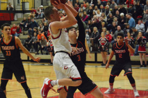 Logan Miller scores two points for the Papermakers on Senior Night Jan. 27, at Camas High School. Miller also made a big basket in the last minute that helped Camas beat Union 50-47 two nights earlier. 