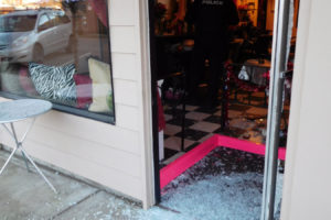 Camas Police Officer Carlos Gonzalez processed the crime scene Monday morning at The Wild Hair. The salon is among several downtown Camas businesses that have been burglarized this month. 