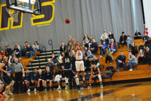 Tre Carlisle delivers a 3-pointer for the Papermakers Saturday, at Columbia River High School. Camas beat Skyview 54-48 to stay alive in the bi-district tournament. 