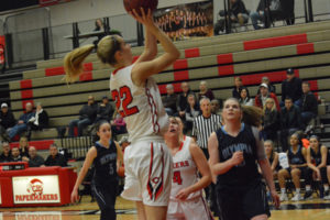 Madison Freemon shoots for two of her 12 points in the first round of the bi-district tournament Feb. 8, at Camas High School. The Papermakers defeated Olympia, 51-35.