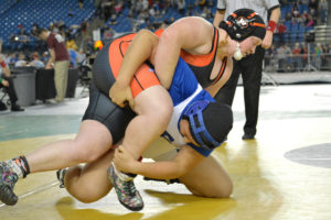 Abby Lees goes for the win in the 235-pound state title match at the Tacoma Dome Saturday. The four-time state finalist became a two-time champion for Washougal.