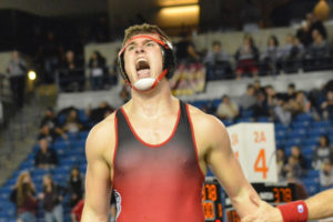 Dylan Ingram screams with joy after winning the 220-pound 4A state championship for Camas Saturday, at the Tacoma Dome. 