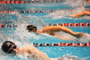 Mark Kim captured three state championship medals for Camas Saturday, at the King County Aquatic Center. He defended his titles in the 200- and 500-meter freestyle races. He also anchored the Papermakers to victory in the 200 freestyle relay. 