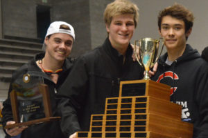 Camas High School seniors Luke Albert, Jeff Fadlovich and Tom Utas hold all the hardware collected by the Papermakers at the 4A state swimming meet Saturday, at the King County Aquatic Center in Federal Way. Camas clinched its first state team championship by a 96-point margin.