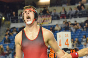 Camas High School senior Dylan Ingram screams with passion after winning the 4A 220-pound state wrestling championship at the Tacoma Dome Saturday.