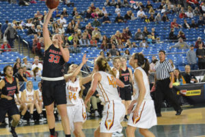 Courtney Clemmer puts the ball off the glass for the Camas High School girls basketball team in the 4A state quarterfinal game March 2, at the Tacoma Dome.