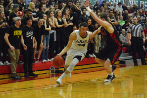 Camas basketball player Trevor Jasinsky dribbles toward the key for the Western Washington Vikings March 3, at the Marcus Pavilion in Lacey. The Vikings beat St. Martin's and Western Oregon to become the Great Northwest Athletic Conference Champions for the first time in school history. 