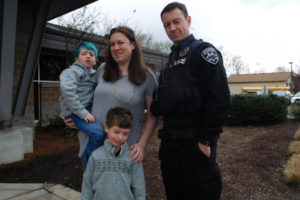 Declan Reagan (with blue hair) is pictured here with his mother, Lauren; his father, Francis; and his twin brother, Adrian.