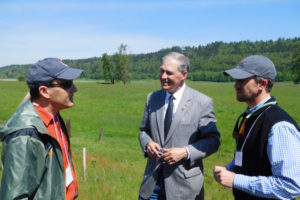 Washington Governor Jay Inslee meets with Kevin Gorman (left), executive director of the Friends of the Columbia Gorge, and Chris Collins (right), principal restoration ecologist with the Lower Columbia Estuary Partnership on Tuesday, May 9, to discuss a habitat restoration and flood-control project at Steigerwald Lake National Wildlife Refuge near Washougal.