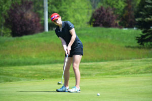 Emma Cox sinks a 40-foot putt for birdie on the 11th green at the Tri-Mountain Golf Course Tuesday. The Camas High School sophomore captured the 4A district championship with two rounds of 76 for a 152.