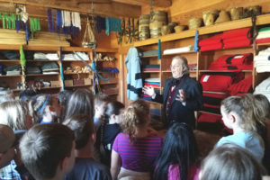 Fourth-grade students from Woodburn Elementary recently toured Fort Vancouver, where they learned about the history of the fur trade, as well as British and American settlers in the area. Here, they listen to a volunteer explain how traders bartered different furs for everything from glass beads to kitchen utensils. 