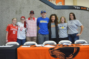 LEFT TO RIGHT: Zoey Brimhall, Chloe Brimhall, Ryan Krout, Collin Prangley, Audrianna Kallie, Elizabeth Gregory and Kayla Lagerquist signed college letters of intent Tuesday at Washougal High School.