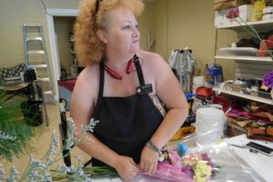 Leslie Rick, owner of the Camas-based Mystic Gardens florist shop, prepares a bouquet for a preschool graduate. Rick recently expanded her business to include a second location at 1924 N.E. Third Ave. Mystic Gardens also has flowers available to purchase from a stand in the Camas Produce parking lot at 2940 N.E. Everett St.