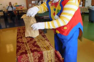 "Klutz, the Magnificent" performs a missing ketchup bottle trick, in front of children and their parents, at the Shriners Hospital for Children, in Portland, on June 28. The hospital recently presented "Klutz," also known as Jim Cobb, of Washougal, a lifetime achievement award for his 36 years of "selfless service for the children."