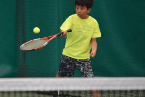 Tenzin Dhargyad returns a volley during the Summer Blast tournament Wednesday, at the Evergreen Tennis Center, in Camas. A total of 22 intermediate and advanced players, ages 12 to 17, helped raise money for the Evergreen Tennis Foundation Scholarship Fund. 