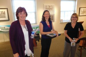 From left to right: Camas City Council member Melissa Smith and challengers Emilia Brasier and Amanda Stamness relax after a League of Women Voters of Clark County forum Tuesday night. 