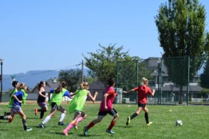 The players at Macaya Soccer Camp sprint for the ball during a scrimmage on July 25. This is the 14th anniversary of the camp created by Dan Macaya, a health and fitness teacher at Liberty Middle School and the new head boys soccer coach at Camas High School. (Tori Benavente/Post-Record)