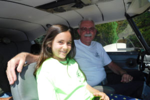 Olivia Leclerc, 9, returns from flying Kent Mehrer's plane, a four-seat Piper Comanche, from Kelso, Washington, to Grove Field Airport, north of Camas, on July 15. Leclerc, of Portland, recently attended a five-day aviation camp coordinated by the Camas-Washougal Aviation Association and the Pearson Field Education Center. 