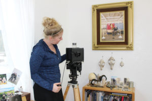 East Clark County artist Megan McGaffigan shows the camera she uses to produce old-fashioned tintype photographs at her light-filled studio at 6904 N.E. 217th Ave., in east Vancouver. McGaffigan will open her studio this weekend as part of the fifth annual Clark County Open Studios tour.