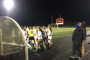 The Camas girls soccer team gathers around Perrin Belzer, who was injured late in Camas' win over Skyline. (Photo by Andy Buhler/The Columbian)