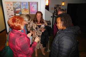 Dr. Roberta Hunte (right), an assistant professor at Portland State University, mingles with members of Soroptimist International of Camas & Washougal, Nov. 14, at the Liberty Theatre, in Camas.