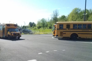 Washougal school bus drivers, seen here pulling into the district's new transportation facility in May, are among the hundreds of classified employees at the Washougal School District who will soon get a 5-percent salary bump, thanks to a new two-year contract approved by the school district this week and ratified by employees in November. (Post-Record file photo)