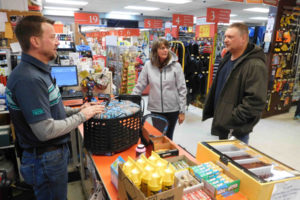 Aaron Lutz, owner of Lutz Hardware, chats with customers Steve and Barb Loewen. The Loewens, both teachers at Camas High School, picked up their screen door that was rescreened at the hardware store in downtown Camas. 