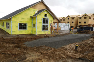 Ninety-seven apartments are being constructed at 2340 Main St., site of the former Angelo soccer field. The building in front will include an exercise room, manager's office and residence. 