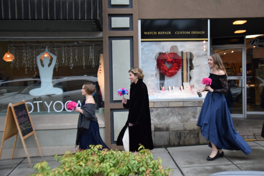 Bride Tami Weidert and her bridesmaids stride down Fourth Avenue before her Feb. 2 wedding ceremony at the Liberty Theatre in downtown Camas.