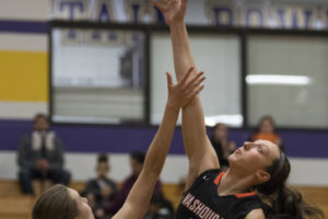 Washougal's Beyonce Bea (5) and Columbia River's Jordan Ryan (30) jump for possession at tipoff during a Feb. 1 game at Columbia River High School. Washougal won 54-53. (Alisha Jucevic/The Columbian)