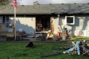 Camas-Washougal firefighters rescued a man and his two dogs from this home on Wednesday, Feb. 14, after a small kitchen fire spread, causing smoke to fill the residence. The firefighters union later filed a complaint with the Washington State Department of Labor and Industries, alleging that low staffing numbers at the fire department lead to unsafe working conditions and make it hard for firefighters to put out fires and save people trapped inside burning buildings. (Photo courtesy of Camas-Washougal Fire Department)