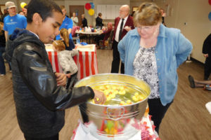 Aundre Pitts, 12, of Washougal, plays the Lucky Duck game during the Salvation Army of Camas/Washougal open house Saturday, Feb. 24, at 1612 "I" St., Washougal. Free hot dogs and popcorn were provided to the more than 400 people who enjoyed the carnival atmosphere. 