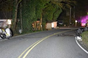 (Photo contributed by the Clark County Sheriff's Office.)
A collision involving a Subaru Legacy sedan (left) and a Kia Spectra sedan (right), caused the death of Joshua Schmid, 21, of Vancouver,  prior to 8:15 p.m., Sunday, at the 36500 block of Northeast Washougal River Road, in Washougal. According to evidence gathered at the scene and witness statements, Schmid was driving the Subaru northbound on Washougal River Road, passing cars and traveling over the centerline of the roadway when it met the southbound Kia. 
