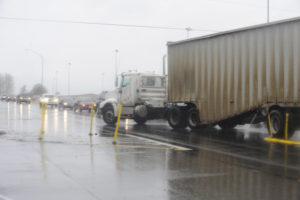 A truck turns into the entrance of the Port of Camas-Washougal Industrial Park at 32nd Street and state Highway 14, in Washougal, April 5. A roundabout will be installed at the intersection in 2019. 