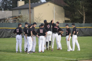 Jason Neve (17) elevates while celebrating a 9-2 win over Heritage on Monday, April 9. 