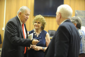 New Washougal City Council member Ernie Suggs (left) talks with City Councilman Ray Kutch, Port of Camas-Washougal Commissioner Larry Keister (right) and Judy Kutch (center), after the Monday, April 23 council meeting. Suggs and Janice Ferguson (not pictured) were the finalists after the council interviewed eight applicants.