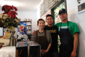 Phillip Park (center), co-owner of Hana Foods, a Korean restaurant in the heart of downtown Camas, and his mother, Agnes (left), were burned in a May 4 kitchen accident. The Camas community has responded by donating more than $10,000 to the family for medical and business expenses. (Post-Record file photo)