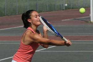 Camas doubles player Olivia Doumitt practices at Camas High School. Doumitt and partner Lucinda Zhang will represent Camas at the bi-district tournament in Kent, Washington.. 