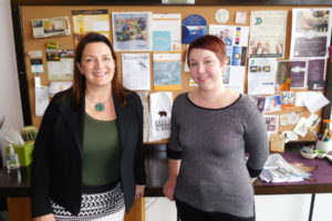 Lori Ann Reed (left), creative collaborator and owner of Reed Creative, LLC, and Heather Dias (right), junior creative collaborator, stand in front of examples of their work. The 20-year-old graphic design business, based in downtown Washougal, has clients in New York, San Francisco, New Orleans and the Northwest.