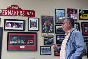 Camas Mayor Scott Higgins tells the story of the "Papermakers Way" street sign and other Camas memorabilia hanging in his City Hall office. 