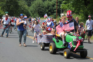 Post-Record file photo
Area resident of all ages walk, bicycle and ride lawn mowers in the American Legion Cape Horn Post 122 and Auxiliary Fourth of July parade in 2014. This year's parade will begin at 11 a.m., Wednesday, July 4, in the Cape Horn-Skye Elementary/Canyon Creek Middle School parking lot, 9731 Washougal River Road, Washougal.