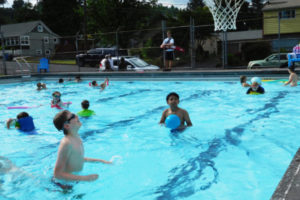 Swimmers enjoy Camas Crown Park swimming pool during the first day of summer in 2016. The 64-year-old pool closed this year after city leaders discovered it would cost hundreds of thousands of dollars to fix the facility. The pool is scheduled to be demolished in the fall. (Post-Record file photo)