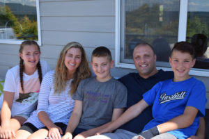 From left to right: Alliyah Barnes, Jennifer Barnes, Ty Barnes, Brody Barnes and Boston Barnes relax on the balcony of their Camas home. The Barnes children went three months without eating sugar for a $100 reward. Ty Barnes completed his first year of a sugar-free diet and committed to doing another full year, until at least April 2019. 