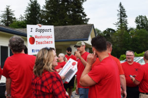 Washougal School District teachers gather outside the Washougal district office before a June 12 school board meeting. (Post-Record file photo)